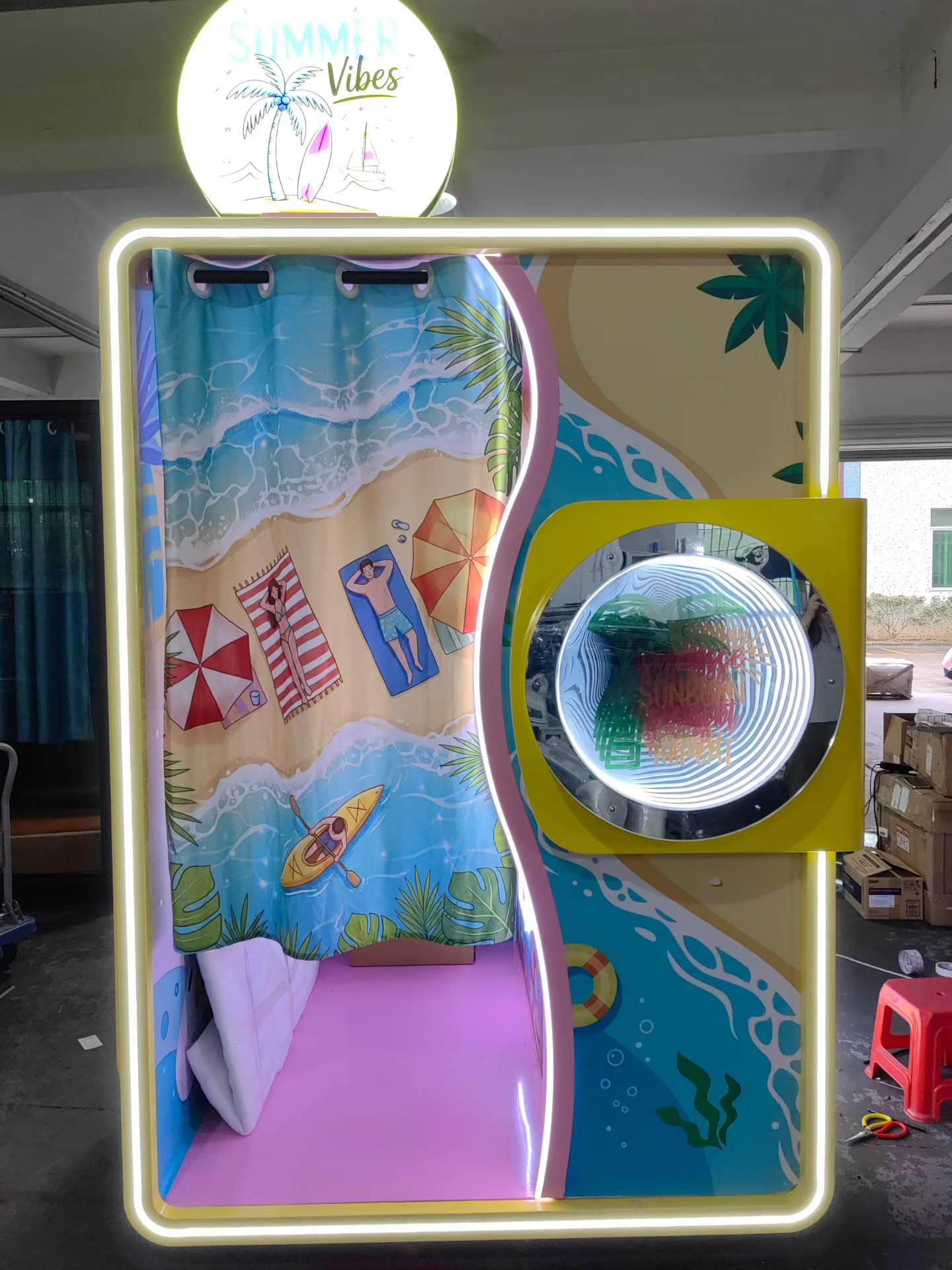 Photo booth with colorful branded exterior and LED lighting