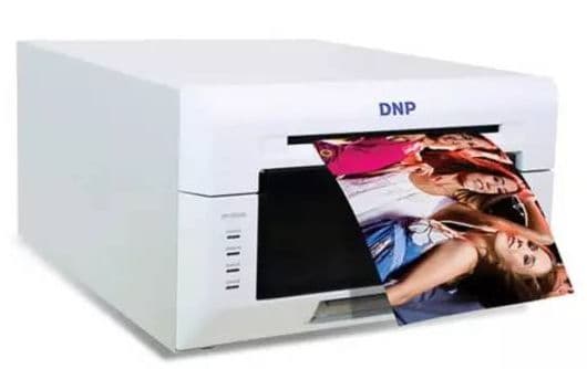 DNP dye-sublimation photo printer producing a printed photo